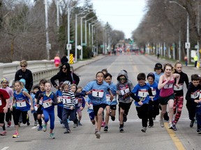 Children sprint away from the starting line as they talk part in the the inaugural Edmonton High Street Mile road race, along 102 Avenue between 139 Street and 125 Street, in Edmonton Sunday May 7, 2017. A series of 1-mile road races for children to elite level runners were held to draw attention to the economic damage caused to area businesses during the rehabilitation of the Groat Road Bridge. Photo by David Bloom