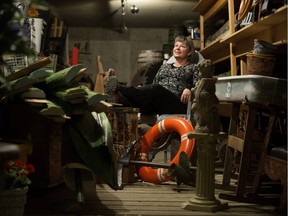 The Citadel Theatre's director of production Cheryl Hoover, poses for a photo in the 'Tunnel', the theatre's underground prop storage room, in Edmonton Friday April 6, 2018.