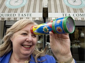 Coun. Bev Esslinger with a kaleidoscope outside Acquired Taste Tea on 124 Street. The store keeps a small box of toys for children to use while parents shop. The city is trying to promote more of this downtown as part of its child friendly initiative.