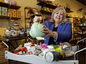 Coun. Bev Esslinger poses for a photo with some of the toys available for children to play with at Acquired Taste Tea, 10122 124 St., in Edmonton Thursday May 3, 2018. The store keeps a small box of toys on hand for children to use while their parents shop. The City is trying to promote more of this downtown as part of its Child Friendly initiative.