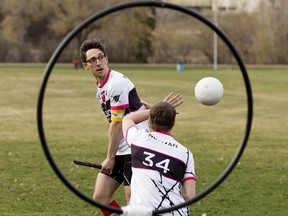 Aurors Quidditch Club members Chris Radojewski (left) and James Neuman demonstrate Quidditch in Kinsmen Park, in Edmonton Friday May 4, 2018.