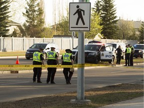Police work at the scene of a hit and run in the crosswalk at 31 Street and 38 Avenue, in Edmonton Tuesday May 8, 2018. A 15 year-old girl was taken to hospital with serious head trauma.