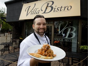 Villa Bistro, 10014 104 St., co-owner Rui Carvalho holds a plate of the restaurant's seafood linguini, in Edmonton on Thursday, May 31, 2018.