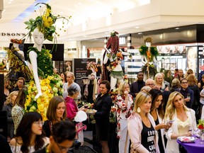 People check out decorated mannequins during Fleurs de Villes at Southgate Centre in Edmonton on Wednesday, May 30, 2018.