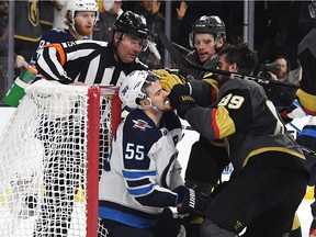 Mark Scheifele of the Winnipeg Jets and Alex Tuch of the Vegas Golden Knights mix it up during the third period in Game Three of the Western Conference Finals during the 2018 NHL Stanley Cup Playoffs at T-Mobile Arena on Wednesday, May 16, 2018 in Las Vegas. The Vegas Golden Knights defeated the Winnipeg Jets 4-2.