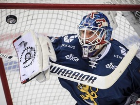 Team Finland goalie Mikko Koskinen blocks a shot during the Channel One Cup of the Euro Hockey Tour ice hockey match between Russia and Finland in Moscow on Dec. 17, 2017.