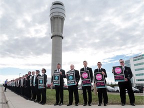 About 150 WestJet pilots protested outside the company's headquarters in Calgary during the WestJet annual general meeting on Tuesday May 8, 2018.
