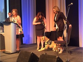 Dogs with Wings executive director Doreen Slessor announces that Rugby, a 21-month-old Labrador retriever, will be gifted to the Be Brave Ranch.