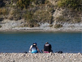 People enjoy a hot summer day on "Accidental Beach" in Edmonton on Tuesday, August 29, 2017.