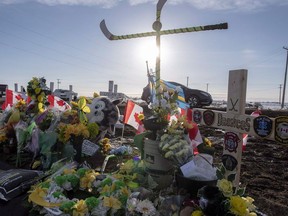 Hockey sticks, messages and other items continue to be added to a memorial at the intersection of a fatal bus crash that killed 16 members of the Humboldt Broncos hockey near Tisdale, Sask. on Saturday, April 14, 2018. Memorial scholarships are being set up in names of four Alberta hockey players who were killed in the Humboldt Broncos bus crash. Logan Hunter, Jaxon Joseph, Conner Lukan and Stephen Wack were among the 16 people killed on April 6 when the junior hockey team's bus and a semi-trailer collided at a rural Saskatchewan intersection.THE CANADIAN PRESS/Liam Richards