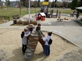 Riverbend area residents play at James Ramsay Park on Riverbend Road in southwest Edmonton.