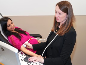 Female doctor examines a woman