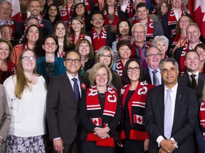 One hundred senior British Columbia business, Indigenous, community and labour leaders pose for a picture with Alberta Premier Rachel Notley after flying to Edmonton from Vancouver on the Federation Flight - a one-day business and economic mission to the Alberta capital on Thursday, May 17, 2018.