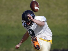 St. Albert high school football player Koen Klinge practices at Foote Field in Edmonton on May 18, 2018.