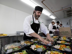 Executive chef Seamus Blue prepares an all-natural turkey cobb salad at Fresh Fit Foods, the in-store food service offered by World Health Edmonton locations, in this 2014 file photo.