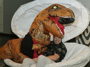 Fringe Festival artistic director Murray Utas hatches from a dinosaur egg Wednesday during the theme reveal for the 37th Edmonton International Fringe Theatre Festival that will take place in Edmonton from Aug. 16-26, 2018. This year's festival is named Fringe "O" Saurus Rex.