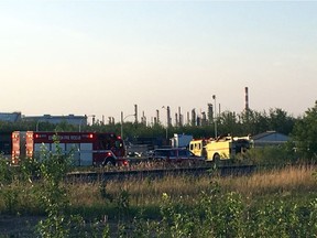 Fire crews at the scene of a grass fire near Imperial Oil Marketing, 3910 92 Ave., in the Eastgate Business Park north of the Sherwood Park Freeway, on Tuesday, May 22, 2018.