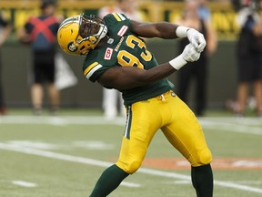 Edmonton's Kwaku Boateng (93) celebrates sacking BC's quarterback Travis Lulay during a CFL game between the Edmonton Eskimos and the BC Lions at Commonwealth Stadium in Edmonton on July 28, 2017.