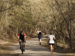 Edmontonians hit the trail to exercise in Mill Creek Ravine in Edmonton, on Sunday, May 6, 2018.