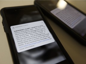 Photo of two Apple iPhones receiving the May 9, 2018 emergency alert test from the Alberta Emergency Management Agency on Wednesday, May 9, 2018.