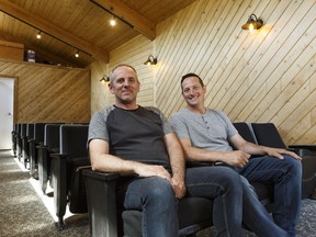 Executive Director John-Mark Gal (left) and Camp Director Pat O'Connor with Hope Adventure Centre pose for a photo in the theatre room of the camp in Sturgeon County on Wednesday, May 23, 2018.