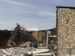 The old Edmonton Petroleum Club, which opened in 1958 and closed in 2014, is seen being demolished by B & B Demolition in Edmonton, on Tuesday, May 29, 2018. The club's members are looking to build a new building according to their website.