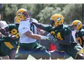 Edmonton Eskimos defensive end Alex Bazzie takes on offensive tackle Colin Kelly during mini-camp drills in Las Vegas, Nev., on Monday, April 23, 2018. Eskimos training camp begins on Saturday.