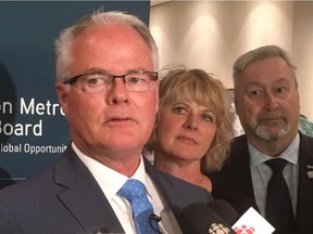 Spruce Grove Mayor Stuart Houston outlines the Edmonton Metropolitan Region Board's support for the Trans Mountain pipeline expansion while Leduc County Mayor Tanni Doblanko and Devon Mayor Ray Ralph look on Monday, May 28, 2018.