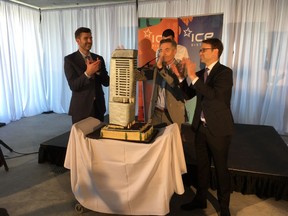Mayor Don Iveson (left), Katz Group Real Estate president Glen Scott and Marriott Hotels Western Canadian vice-president Martin Stitt (right) applaud the cake produced for a topping-off ceremony for Edmonton's JW Marriott-Legends Private Residences tower Tuesday, May 8, 2018.