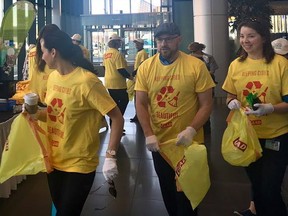 City of Edmonton employees rush through the Edmonton Tower on Tuesday, May 8, 2018 as they race to collect the most litter they can in the 15-to-Clean Challenge.