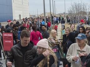 Chris Warnock and Kennedy Kiss lined up at midnight to be first in line for the 10am opening of the Premium Outlet Collection. Grand opening of the new enclosed outlet mall at Edmonton International Airport on May 2, 2018 in Leduc County.