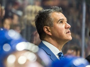 Swift Current Broncos' head Coach Manny Viveiros watches an instant replay during a game against the Regina Pats at the Brandt Centre in Regina. (BRANDON HARDER/REGINA LEADER-POST) ORG XMIT: POS1803312236028940
