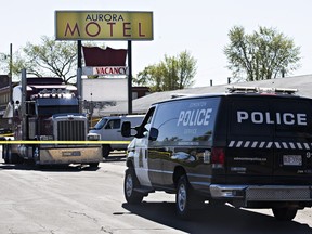 Police investigate after a man was found seriously injured near the Aurora Motel on 111 Avenue and 151 Street in Edmonton, Alta. on Wednesday, May 20, 2015.