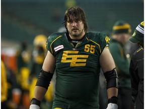 Edmonton Eskimos offensive lineman Simeon Rottier walks off the field during the second half of a CFL game between the Edmonton Eskimos and the Montreal Alouettes at Commonwealth Stadium on Sunday November 1, 2015.