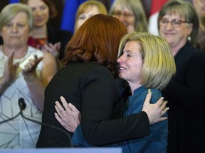Carlynn McAneeley (left), a survivor of sexual violence, is hugged by Premier Rachel Notley (right) at the Alberta legislature on Tuesday ,May 1, 2018, where the premier proclaimed the month of May as Sexual Violence Awareness Month.