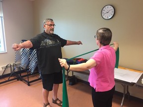 Two SHAPES participants demonstrate exercises they can work on as part of the 12-week program.