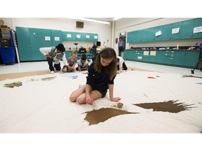 Staff and students from Rio Terrace School are working with local Elder Phillip Campiou to paint a teepee inside their school. Campiou had students research their family history, then create designs for the teepee that were symbolic of each of their families.