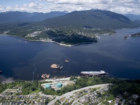 A aerial view of Kinder Morgan's Trans Mountain marine terminal, in Burnaby, B.C., is shown on Tuesday, May 29, 2018. The federal Conservatives say if the Liberals are willing to pony up billions of dollars to save the Trans Mountain pipeline to Canada's west coast, that it should be willing to provide the same level of certainty to revive the Energy East pipeline to Canada's east coast THE CANADIAN PRESS Jonathan Hayward ORG XMIT: JOHV105