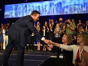 United Conservative Party Leader Jason Kenney shakes the hands of supporters after speaking at the United Conservative Party's 2018 Annual General Meeting and founding convention in Red Deer, on Saturday, May 5, 2018.