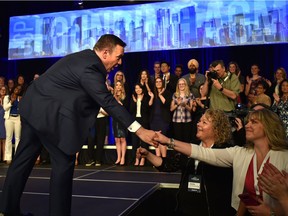 United Conservative Party Leader Jason Kenney shakes supporters hands after speaking at the United Conservative Party's 2018 Annual General Meeting and founding convention in Red Deer, May 5, 2018.