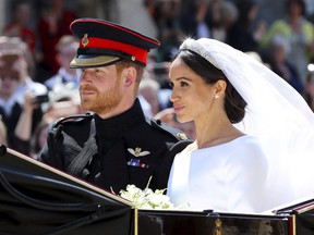 Britain's Prince Harry and his wife Meghan Markle leave after their wedding ceremony, at St. George's Chapel in Windsor Castle in Windsor, near London, England, Saturday, May 19, 2018.