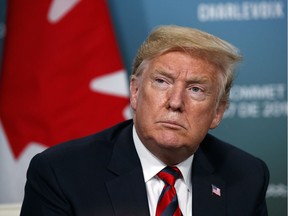 President Donald Trump listens to a question during a meeting with Canadian Prime Minister Justin Trudeau during the G-7 summit, Friday, June 8, 2018, in Charlevoix, Canada.