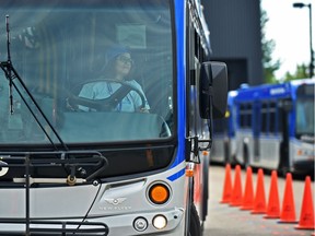 Reporter Hina Alam at the wheel of a 12.2-metre ETS bus when media was invited to participate in the 2018 Transit Skills (Bus Rodeo) Competition at the ETS Centennial Garage in Edmonton on Saturday, June 23, 2018.