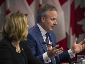 Stephen Poloz, governor of the Bank of Canada, right, speaks while Carolyn Wilkins, senior deputy governor at the Bank of Canada, listens during a press conference in Ottawa, Ontario, Canada, on Thursday, June 7, 2018.