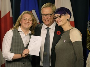 David Eggen (middle, Alberta Minister of Education), Ace Peace (left, transgender student) and Lindsay Peace (right, mother of Ace Peace) at the Alberta Legislature on Thursday November 2, 2017 where David Eggen introduced Bill 24 to strengthen Gay Straight Alliance (GSA) legislation in Alberta.