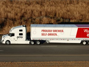 A truck hauling 50,000 cans of Budweiser beer cruises down Colorado's busy Interstate 25 in 2016 in the world's first autonomous truck delivery.