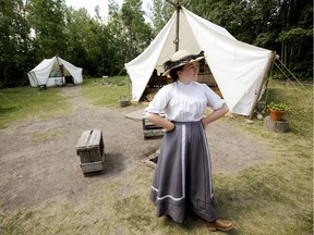 Historical Interpreter Alyssa Blanchett chats with visitors to 1905 Street at Fort Edmonton Park in Edmonton on July 6, 2017.