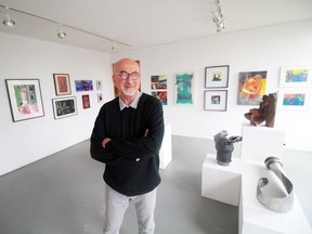 Harcourt House Artist Run Centre's executive director Jacek Malec in the sunny gallery space.