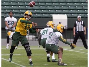 Mike Reilly (13) takes part in an Edmonton Eskimos practice at Commonwealth Stadium, in Edmonton Monday June 4, 2018.