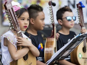 Members of the Filipino-Canadian Saranay Association of Alberta wait to perform during the 2018 Edmonton Filipino Fiesta in Borden Park, June 23, 2018. On Thursday the province announced it will develop a K-12 Filipino language and culture program, to be ready for interested schools by 2020.